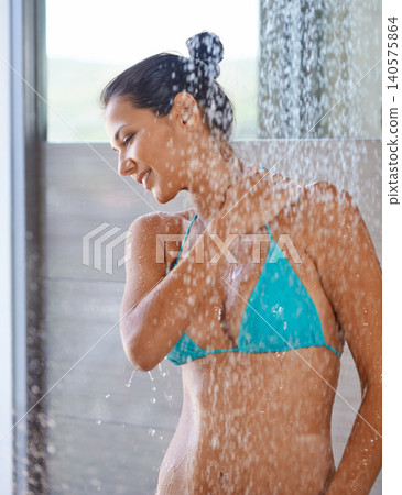 Showering after a swim, wet and woman with wellness, smile and healthy with morning routine. Person, hotel and girl with water and bikini with cleaning, body and happy with hospitality and liquid Showering after a swim, wet and woman with wellness, smile and healthy with morning routine. Person, hotel and girl with water and bikini with cleaning, body and happy with hospitality and liquid 140575864