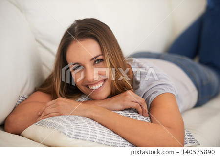 Happy woman, portrait and relax on sofa in living room, calm and comfort with positive mood for leisure. Rest, lying down with pillow and smile for stress relief, break on day off or weekend at home Happy woman, portrait and relax on sofa in living room, calm and comfort with positive mood for leisure. Rest, lying down with pillow and smile for stress relief, break on day off or weekend at home 140575890