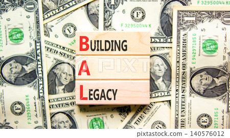 BAL building a legacy symbol. Concept words BAL building a legacy on beautiful wooden blocks. Beautiful dollar bills background. Dollar bills. Business BAL building a legacy concept. Copy space. 140576012