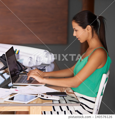 Woman, typing on laptop and remote work with finance paperwork on desk, budget and admin for tax audit. Home office, advisor reading for financial planning and invoice, credit report and technology Woman, typing on laptop and remote work with finance paperwork on desk, budget and admin for tax audit. Home office, advisor reading for financial planning and invoice, credit report and technology 140576126