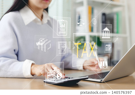 Tax calculation and financial planning concept. Woman using calculator and laptop with tax icon, financial management, tax return preparation, accounting, business taxation, and government compliance. 140576397