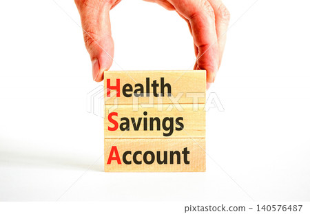 HSA health saving account symbol. Concept words HSA health saving account on beautiful wooden blocks. Beautiful white background. Doctor hand. Medical HSA health saving account concept. Copy space. HSA health saving account symbol. Concept words HSA health saving account on beautiful wooden blocks. Beautiful white background. Doctor hand. Medical HSA health saving account concept. Copy space. 140576487