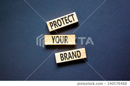 Protect your brand words symbol. Concept words Protect your brand on beautiful wooden blocks. Beautiful black background. Business and protect your brand concept. Copy space. Protect your brand words symbol. Concept words Protect your brand on beautiful wooden blocks. Beautiful black background. Business and protect your brand concept. Copy space. 140576488