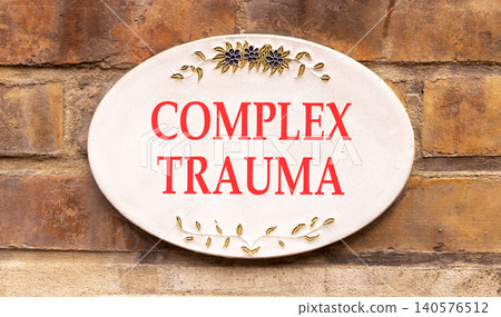 Complex trauma words symbol. Concept words Complex trauma on beautiful white sign plate. Beautiful brown brick wall background. Psychological complex trauma support concept. Copy space. Complex trauma words symbol. Concept words Complex trauma on beautiful white sign plate. Beautiful brown brick wall background. Psychological complex trauma support concept. Copy space. 140576512