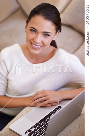 Woman, portrait and laptop for remote work in home, networking and smile for copywriting or blog. Female person, living room and happy for website research for article, information and app on tech Woman, portrait and laptop for remote work in home, networking and smile for copywriting or blog. Female person, living room and happy for website research for article, information and app on tech 140576515