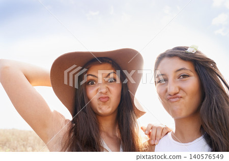 Women, friends and portrait with funny face outdoor on holiday connection in summer, bonding or together. Female person, travel and humor in Australia or nature vacation as students, goofy or meme Women, friends and portrait with funny face outdoor on holiday connection in summer, bonding or together. Female person, travel and humor in Australia or nature vacation as students, goofy or meme 140576549