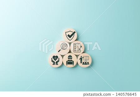 Work safety and compliance concept. Wooden blocks safety-related icons, including compliance, health, inspection, training, protection, regulatory, workplace safety, and risk management. Safety first, Work safety and compliance concept. Wooden blocks safety-related icons, including compliance, health, inspection, training, protection, regulatory, workplace safety, and risk management. Safety first, 140576645