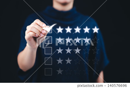 Customer satisfaction and rating review concept. Woman selecting five star rating on digital interface, represent customer satisfaction, service quality, feedback, and online reviews. User experience, Customer satisfaction and rating review concept. Woman selecting five star rating on digital interface, represent customer satisfaction, service quality, feedback, and online reviews. User experience, 140576696