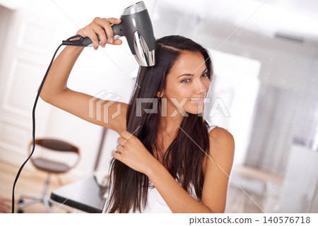 Smile, home and woman with dryer for hair, getting ready and happy grooming for straight hairstyle. Style, face and girl in apartment with blowdryer for haircare, morning routine or heat treatment 140576718