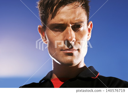 Man, portrait and confident football player in outdoors, athlete and competitive for match or game. Male person, serious face and determined for competition, blue sky and focus for workout challenge 140576719