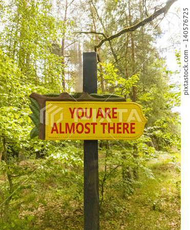 You are almost there words symbol. Concept words You are almost there on beautiful yellow road sign. Beautiful forest background. Business You are almost there motivational support concept. Copy space You are almost there words symbol. Concept words You are almost there on beautiful yellow road sign. Beautiful forest background. Business You are almost there motivational support concept. Copy space 140576725