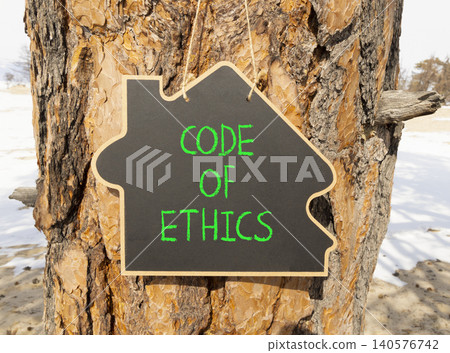 Code of ethics words symbol. Concept words Code of ethics on beautiful black blackboard. Beautiful old tree background. Business Code of ethics concept. Copy space. 140576742