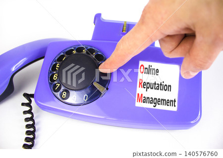 ORM online reputation management symbol. Concept words ORM online reputation management on beautiful old disk phone. Businessman hand. Beautiful white background. Business ORM concept. Copy space. ORM online reputation management symbol. Concept words ORM online reputation management on beautiful old disk phone. Businessman hand. Beautiful white background. Business ORM concept. Copy space. 140576760