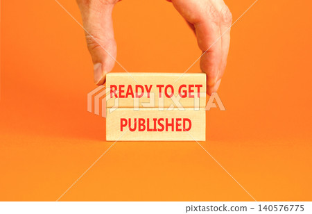 Ready to get published words symbol. Concept words Ready to get published on beautiful wooden blocks. Beautiful orange background. Business ready to get published motivational concept. Copy space. 140576775
