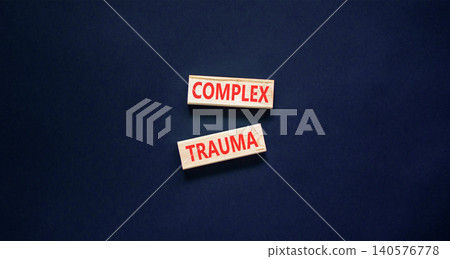 Complex trauma words symbol. Concept words Complex trauma on beautiful wooden blocks. Beautiful black background. Psychological complex trauma support concept. Copy space. 140576778