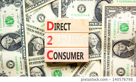 DTC direct 2 consumer symbol. Concept words DTC direct 2 consumer on beautiful wooden blocks. Beautiful dollar bills background. Dollar bills. Business DTC direct 2 consumer concept. Copy space. DTC direct 2 consumer symbol. Concept words DTC direct 2 consumer on beautiful wooden blocks. Beautiful dollar bills background. Dollar bills. Business DTC direct 2 consumer concept. Copy space. 140576798