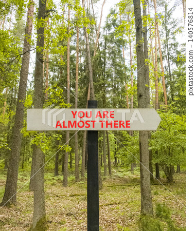 You are almost there words symbol. Concept words You are almost there on beautiful grey road sign. Beautiful forest background. Business You are almost there motivational support concept. Copy space You are almost there words symbol. Concept words You are almost there on beautiful grey road sign. Beautiful forest background. Business You are almost there motivational support concept. Copy space 140576814