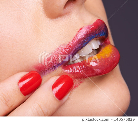 Lipstick, smear and woman for beauty with hand, makeup and red nail polish with cosmetic product in studio. Face, smudge on skin and color for cosmetology with manicure, creativity and glamour 140576829