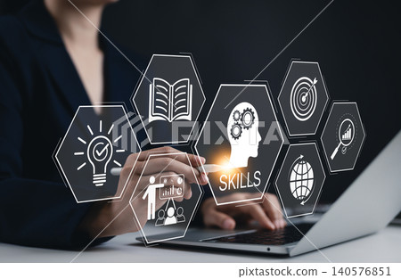 Skills Development and Learning for Personal Growth. Businesswoman interact with icons representing skills, education, and learning, personal development and professional growth through technology. 140576851