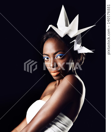Studio, portrait and natural cosmetics for black woman in dark background with aesthetic for honor. Eyeshadow, glow and foundation on face of girl for shine, African female person and origami birds Studio, portrait and natural cosmetics for black woman in dark background with aesthetic for honor. Eyeshadow, glow and foundation on face of girl for shine, African female person and origami birds 140576881