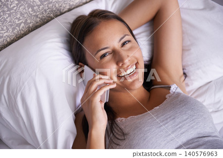 Relax, portrait and phone call for woman on bed with smile on soft mattress of bedroom in apartment. Pillow, female person and rest of girl talking with mobile, technology and happiness on face Relax, portrait and phone call for woman on bed with smile on soft mattress of bedroom in apartment. Pillow, female person and rest of girl talking with mobile, technology and happiness on face 140576963