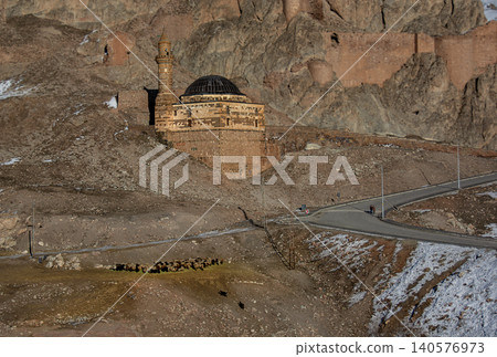 High-angle view of the historical Eski Bayezid Cami (Old Beyazit Mosque) and ancient Urartian Castle walls, Dogubayazit, Turkey. High-angle view of the historical Eski Bayezid Cami (Old Beyazit Mosque) and ancient Urartian Castle walls, Dogubayazit, Turkey. 140576973