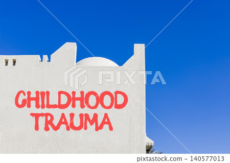 Childhood trauma words symbol. Concept words Childhood trauma on beautiful white wall. Beautiful blue sky background. Psychological childhood trauma support concept. Copy space. 140577013