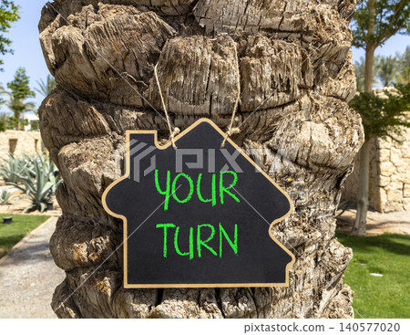 Your turn words symbol. Concept words Your turn on beautiful black blackboard. Beautiful palm tree background. Business your turn motivational support concept. Copy space. Your turn words symbol. Concept words Your turn on beautiful black blackboard. Beautiful palm tree background. Business your turn motivational support concept. Copy space. 140577020
