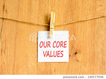 Our core values words symbol. Concept words Our core values on beautiful white paper on wooden clothespin. Beautiful wooden background. Business our core values motivational support concept Copy space Our core values words symbol. Concept words Our core values on beautiful white paper on wooden clothespin. Beautiful wooden background. Business our core values motivational support concept Copy space 140577046