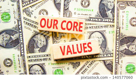 Our core values symbol. Concept words Our core values on beautiful wooden blocks. Beautiful dollar bills background. Dollar bills. Business our core values motivational support concept. Copy space. Our core values symbol. Concept words Our core values on beautiful wooden blocks. Beautiful dollar bills background. Dollar bills. Business our core values motivational support concept. Copy space. 140577060