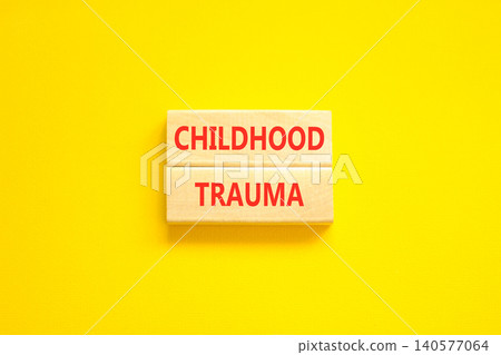 Childhood trauma words symbol. Concept words Childhood trauma on beautiful wooden blocks. Beautiful yellow background. Psychological childhood trauma support concept. Copy space. 140577064