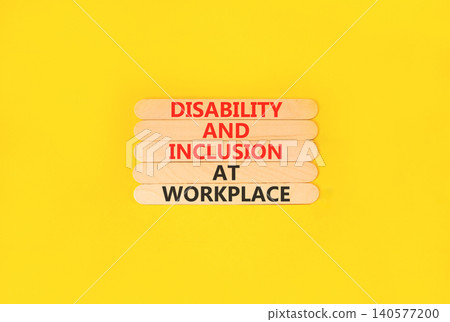 Disability and inclusion symbol. Concept words Disability and inclusion at workplace on beautiful wooden sticks. Beautiful yellow background. Disability and inclusion at workplace concept. Copy space. 140577200