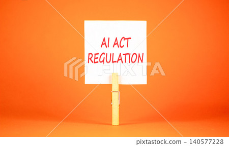 AI act regulation words symbol. Concept words AI artificial intelligence act regulation on beautiful white paper. Beautiful orange background. Business AI act regulation concept. Copy space. AI act regulation words symbol. Concept words AI artificial intelligence act regulation on beautiful white paper. Beautiful orange background. Business AI act regulation concept. Copy space. 140577228