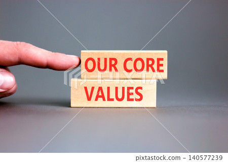 Our core values words symbol. Concept words Our core values on beautiful wooden blocks. Beautiful grey background. Businessman hand. Business our core values motivational support concept. Copy space Our core values words symbol. Concept words Our core values on beautiful wooden blocks. Beautiful grey background. Businessman hand. Business our core values motivational support concept. Copy space 140577239