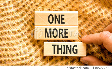 One more thing words symbol. Concept words One more thing on beautiful wooden blocks. Beautiful canvas background. Businessman hand. Business and one more thing concept. Copy space. One more thing words symbol. Concept words One more thing on beautiful wooden blocks. Beautiful canvas background. Businessman hand. Business and one more thing concept. Copy space. 140577268