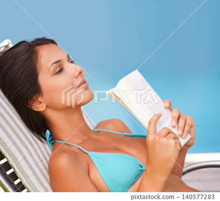 Woman, bikini and swimming pool relax with book for holiday vacation at hotel accommodation, summer or resting. Female person, swimwear and reading in Hawaii for travel resort, tanning or peaceful Woman, bikini and swimming pool relax with book for holiday vacation at hotel accommodation, summer or resting. Female person, swimwear and reading in Hawaii for travel resort, tanning or peaceful 140577283