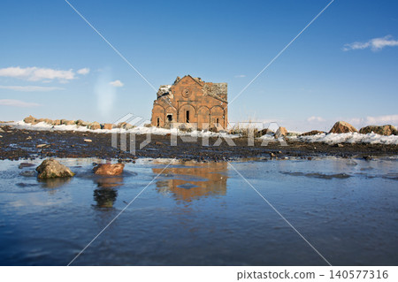 The ancient Cathedral of Ani with water reflection and winter snow in Kars, Turkey The ancient Cathedral of Ani with water reflection and winter snow in Kars, Turkey 140577316