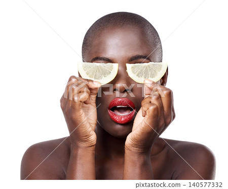 Woman, surprise and lemon skincare in studio for organic dermatology routine, youth or wellness. White background, shock and African model with facial glow, fruit diet and eyes product for beauty 140577332