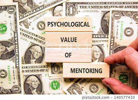 Value of mentoring symbol. Concept words Psychological value of mentoring on beautiful wooden blocks. Beautiful dollar bills background. Business psychological value of mentoring concept. Copy space. Value of mentoring symbol. Concept words Psychological value of mentoring on beautiful wooden blocks. Beautiful dollar bills background. Business psychological value of mentoring concept. Copy space. 140577410