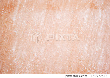 pink orange wall texture with traces of white whitewash 140577515