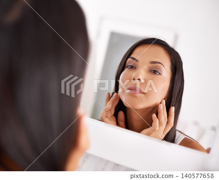 Woman, makeup and skin care in bathroom mirror with beauty, dermatology or happy for face results. Young person with smile in reflection for facial foundation, cosmetics and getting ready at home Woman, makeup and skin care in bathroom mirror with beauty, dermatology or happy for face results. Young person with smile in reflection for facial foundation, cosmetics and getting ready at home 140577658