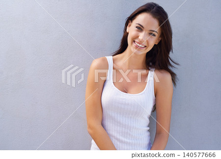Portrait, smile and woman with fashion, casual outfit and happiness on a grey background. Face, mockup space and person with stylish clothes and girl with sunshine and weekend break with confidence 140577666