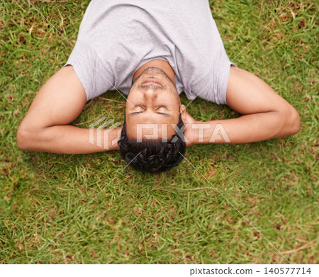 Man, outdoor and sleep on lawn, grass and eyes closed in dreaming outside for summer in nature. Male person, backyard and adult to relax, peace and vacation in garden or park for peace and calm Man, outdoor and sleep on lawn, grass and eyes closed in dreaming outside for summer in nature. Male person, backyard and adult to relax, peace and vacation in garden or park for peace and calm 140577714