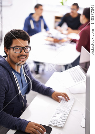 Happy man, portrait and design with computer for creative startup, research or development at office. Face of male person, nerd or geek with smile for technology or digital career at the workplace Happy man, portrait and design with computer for creative startup, research or development at office. Face of male person, nerd or geek with smile for technology or digital career at the workplace 140577842