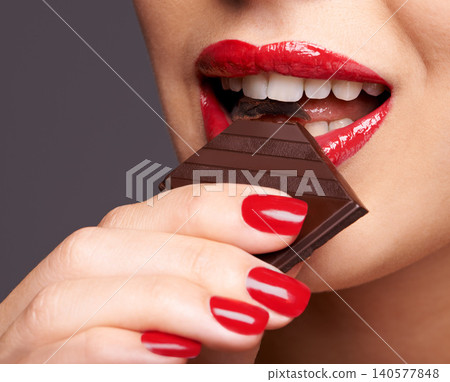 Makeup, beauty and woman with chocolate in studio for lipstick cosmetics, manicure and skincare in gray background. Sweets, macro and female model for cocoa bar unhealthy snack or eating candy Makeup, beauty and woman with chocolate in studio for lipstick cosmetics, manicure and skincare in gray background. Sweets, macro and female model for cocoa bar unhealthy snack or eating candy 140577848