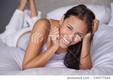 Wake up, laughing or portrait of woman in bed for resting to relax in a home, house or apartment. Funny, morning or face of a happy person with wellness, comfortable mattress or confidence in bedroom Wake up, laughing or portrait of woman in bed for resting to relax in a home, house or apartment. Funny, morning or face of a happy person with wellness, comfortable mattress or confidence in bedroom 140577888