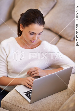 Woman, networking and laptop for remote work on internet, home and tech for copywriting or blog. Female person, living room and online for website research for article, information and app for email Woman, networking and laptop for remote work on internet, home and tech for copywriting or blog. Female person, living room and online for website research for article, information and app for email 140577970