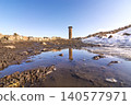 Reflection of Menuchehr Mosque minaret in a water puddle during winter at Ani Ruins, Kars, Turkey Reflection of Menuchehr Mosque minaret in a water puddle during winter at Ani Ruins, Kars, Turkey 140577971