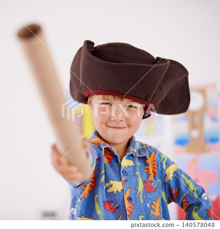 Child, portrait or costume as pirate to play in fantasy in his bedroom with telescope toy or smile. Kid sailor, proud captain or happy boy in a game with pyjamas, hat or creative monocule to sail Child, portrait or costume as pirate to play in fantasy in his bedroom with telescope toy or smile. Kid sailor, proud captain or happy boy in a game with pyjamas, hat or creative monocule to sail 140578048