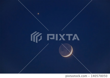 Crescent moon and bright venus planet in the dark blue night sky Crescent moon and bright venus planet in the dark blue night sky 140578050